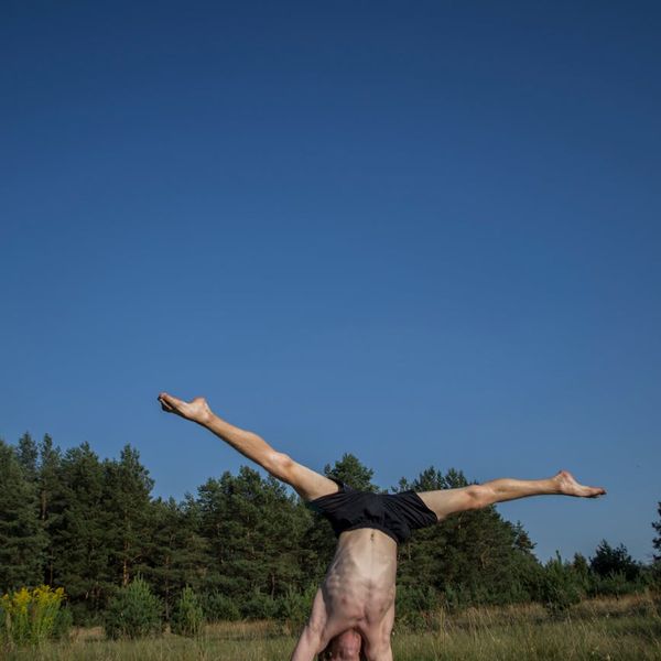 Man performing a stability exercise in a calm environment.